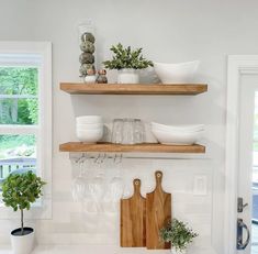 the kitchen counter is clean and ready to be used for dishes, wine glasses, and other things