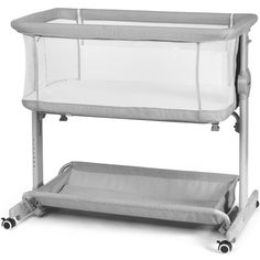 a gray and white baby crib on wheels