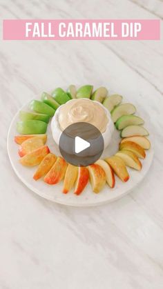 a plate with apples, kiwis and dip on it that says fall caramel dip