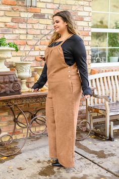 We are falling head over heels for the Franco Corduroy Overalls In Camel! A lightweight, corduroy fabric shapes an apron neckline with a bib front, side pockets, and button detail straps that adjust the length. A racerback drops into wide leg, full length pants detailed with two back pockets. Exposed side buttons make for easy on and off. Material100% PolyesterNo stretchAdjustable strapsSide pocketsWide leg silhouetteTrue to size, size to hipsWash cold, hang dry Model FitMegan is wearing size 1X Corduroy Jumpsuit, More Than Friends, Full Length Pants, Corduroy Overalls, Collar Vest, An Apron, Graphic Tee Dress, Pants Details, Corduroy Fabric