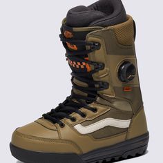 a pair of brown and black snowboard boots