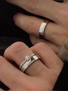 two people with wedding rings on their hands