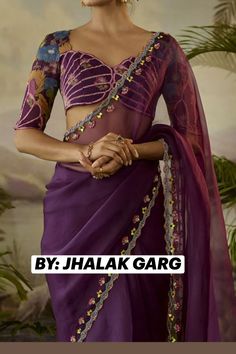 PURPLE ORGANZA HAND EMBROIDED SAREE.  Purple Saree Set that captivates with its elegance. The eye-catching piece is crafted in organza with cutwork and zardosi hand embroidery. It is paired with a modal satin printed blouse piece. Accessorise the designer saree set with statement earrings and heels for a festive occasion.  #Beautiful#Lovely#Grace#Elegant#FestiveWear#SareeAura#Style#Look#Trending#theColour. Sangeet Outfit Saree, Cute Saree Blouse, Chiffon Blouse Designs For Saree, Saree Border Work Designs, Blouse Designs Organza Saree, Printed Saree Blouse Design, Organza Sarees Blouses Design, Purple Bridal Saree, Saree Work Design Embroidery