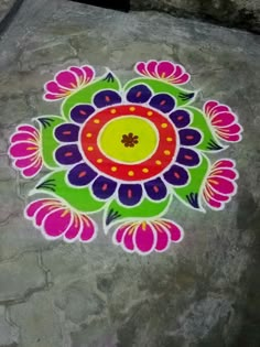 a colorful flower design on the ground