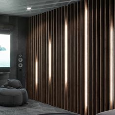 a living room filled with furniture and a flat screen tv sitting on top of a wooden wall