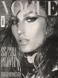 a magazine cover featuring a woman with long hair and jewelry on her face, in black and white