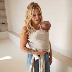 a woman holding a baby in her arms