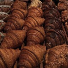 many croissants and pastries are on display