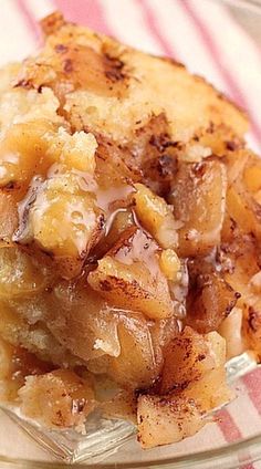 a close up of a plate of food on a table cloth with a fork and knife