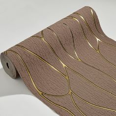 a roll of brown paper with gold lines on it