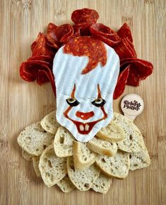 a close up of a piece of food with a clown mask on top of it