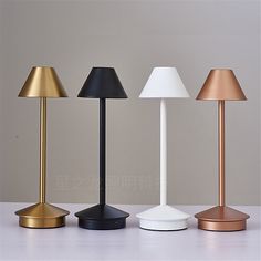 three different types of lamps on a table