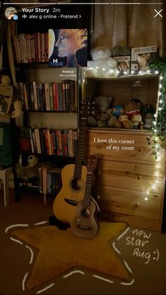 a guitar sitting on top of a wooden floor next to a book shelf