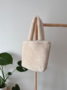 ABOUT THE BAG: - Handmade and hand-sewn by me with love and care <3 - Minimalist style and eco friendly and long lasting material. - Perfect to use for work, travel and works well as a reusable shop bag. - Ready to ship. SIZES:  Small : 14 inc / 37 cm wide and 13 inc / 35 cm tall. Large: 40 cm wide and 37 cm tall  XL : 42 cm wide and 38 cm tall  SHIPPING INFO: - In USA your order reach you in 3-6 business day, everywhere else in 3-7 business days. * I will be happy to see you again! NOTE: - If you tired of plastic bags this bag for you! Say no to plastic bags and be easy on environment. ENJOY YOUR NEW BAG! Sherpa Bag, Fluffy Bags, Ropa Dark, Fluffy Tote Bag, Fluffy Purse, Winter Tote, Shop Bag, Collection Ideas, Bag Y2k