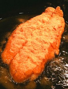 a fried piece of meat in a frying pan