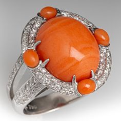 an orange jade and diamond ring