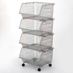 four plastic baskets stacked on top of each other in front of a white background with black wheels