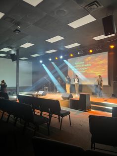 a group of people standing on top of a stage