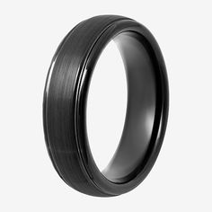 a black wedding ring with a satin finish on the outside and an interior line in the inside