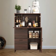 a wooden cabinet filled with lots of bottles and condiments on top of it