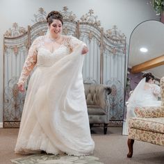 a woman in a wedding dress is smiling and posing for the camera with her arms spread out