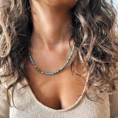 This necklace combines the vibrant spirit of African turquoise with the elegance of crystal beads and gold-plated accents, creating a timeless and versatile piece. Perfect for lovers of boho-chic style, this handmade accessory is designed to bring a sense of calm and creativity to every outfit. - Handcrafted with high-quality natural gemstones and durable and long-lasting gold-plated accents - Features African turquoise, Crystal beads - Adjustable fit for comfortable wear between 44 cm to 49 cm Gold Turquoise Necklace With Round Beaded Details, Bohemian Gold Emerald Necklace With Gemstone Beads, Turquoise Beaded Necklaces With Spacer Beads, Turquoise Beaded Necklace With Spacer Beads, Adjustable Turquoise Necklaces With Gold Beads, Adjustable Turquoise Necklace With Gold Beads, Adjustable Gold Turquoise Necklace With Colorful Beads, Gold Turquoise Necklace With Colorful Beads As Gift, Turquoise Beaded Necklaces For Healing