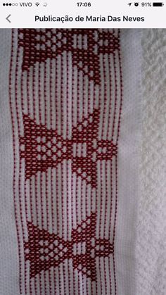 a red and white piece of cloth on top of a table