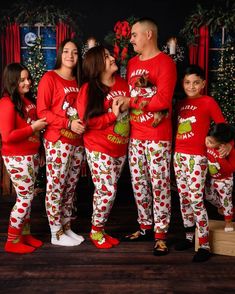 Celebrate the magic of the season with our Merry Grinchmas Family Matching Pajama Set! This delightful set features a vibrant red top showcasing a playful holiday graphic that reads "Merry Grinchmas," perfect for spreading cheer. The coordinating pants boast a white base adorned with whimsical holiday characters, making it an ideal choice for family gatherings, cozy movie nights, or festive celebrations. Key Features: Soft and Comfortable: Crafted from a cozy cotton blend, these pajamas provide Family Holiday Pajamas, Holiday Characters, Matching Pajama Set, Christmas Pajamas Kids, Matching Pajama, Merry Grinchmas, Patterned Pants, Matching Christmas Pajamas, Family Christmas Pajamas