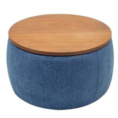 a blue ottoman with wooden top on a white background, it is also available for use as a coffee table