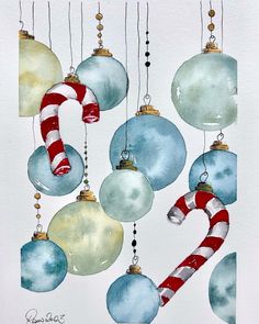 a watercolor painting of christmas ornaments hanging from strings and candy canes on white paper