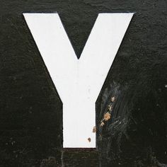 the letter y is painted white and black