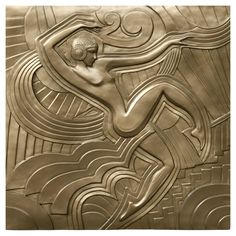 an art deco tile with a woman in the center and waves on it's face