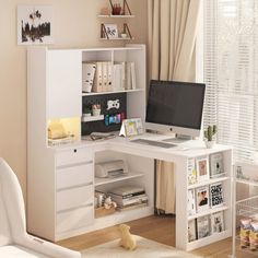 a white desk with a computer on top of it