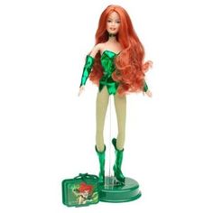 a doll with long red hair and green outfit is standing next to a tin can