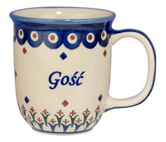 a blue and white coffee mug with the word gost on it's side