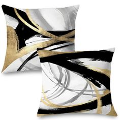 two black and white decorative pillows with gold accents on each pillow, one is square