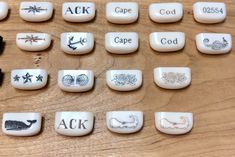 a wooden table topped with lots of different types of buttons