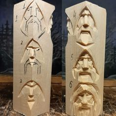 two wooden sculptures with faces on them