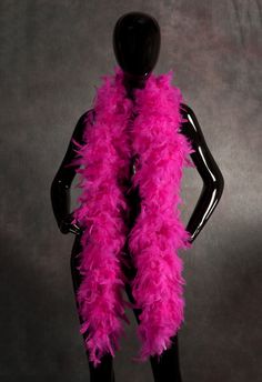 a mannequin wearing a pink feather scarf