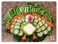 a turkey made out of cucumbers and carrots