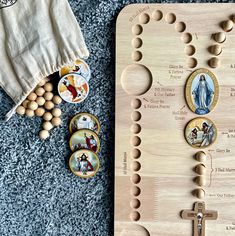 a wooden board with buttons and magnets on it next to a white t - shirt