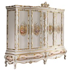 an ornate white and gold painted armoire in a room with hardwood floors, walls and rugs