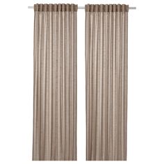 two beige curtains hanging on the side of a window