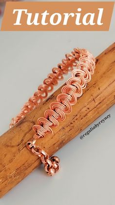 a close up of a wooden stick with some metal items on it and the words, how to make wire wrapped bracelets