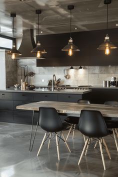 an industrial style kitchen and dining room with dark wood cabinets, marble countertops and black chairs