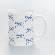 💙 Coquette Blue Bow Ceramic Mug 💙 A coquette-inspired ceramic mug that has hand-drawn illustrations of blue bows. Crafted from high-quality ceramic, it offers both elegance and durability. Perfect for coffee, tea, or hot chocolate, it makes a delightful gift for yourself or a loved one.  Durable white ceramic Sizes: 11oz  Lead and BPA-Free Microwave & dishwasher safe Mug Inspo Design, Bow Mug, Pottery Painting Inspiration, Bow Ceramic, Coquette Blue, Clay Painting, Pottery Painting Designs, Painted Mugs, Blue Bow