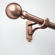 a close up of a curtain rod with a ball on it's back end