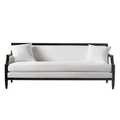 a black and white couch with three pillows