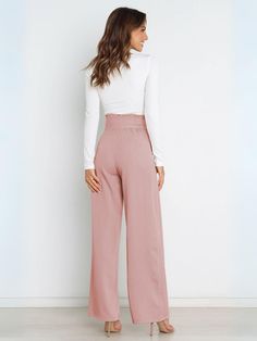 Add some flair to your wardrobe with our Iconic High Rise Pocketed Trouser Pants in blush pink. Featuring a chic bow-tie belt, these pants are perfect for any stylish occasion. Stay comfortable all day long with the high rise fit and functional pockets. Upgrade your look with a touch of playful sophistication! Size Guide: Model is 5’6” tall, and has a 32.2” bust, 26.2” waist, & 34.8” hips. She is wearing a S / US 4 / AU 8. This pants is true to size. Material: 100% Polyester . Feature: Side Pockets. High rise. Straight leg. Front zip fly. Adjustable Bow-Tie Belt. Not Lined. Care Instructions: Machine wash / Cold hand wash Casual Tie, Tie Length, Legging Sport, Weave Style, Pantalon Large, Wide Legs, Polished Look, Wide Leg Trousers, Spring Summer Fashion