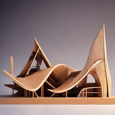 a wooden model of a building with wavy lines